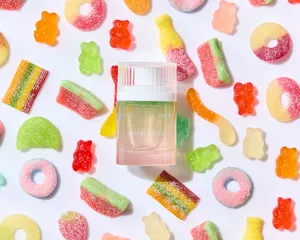 Snif Swede Tooth perfume surrounded by candy